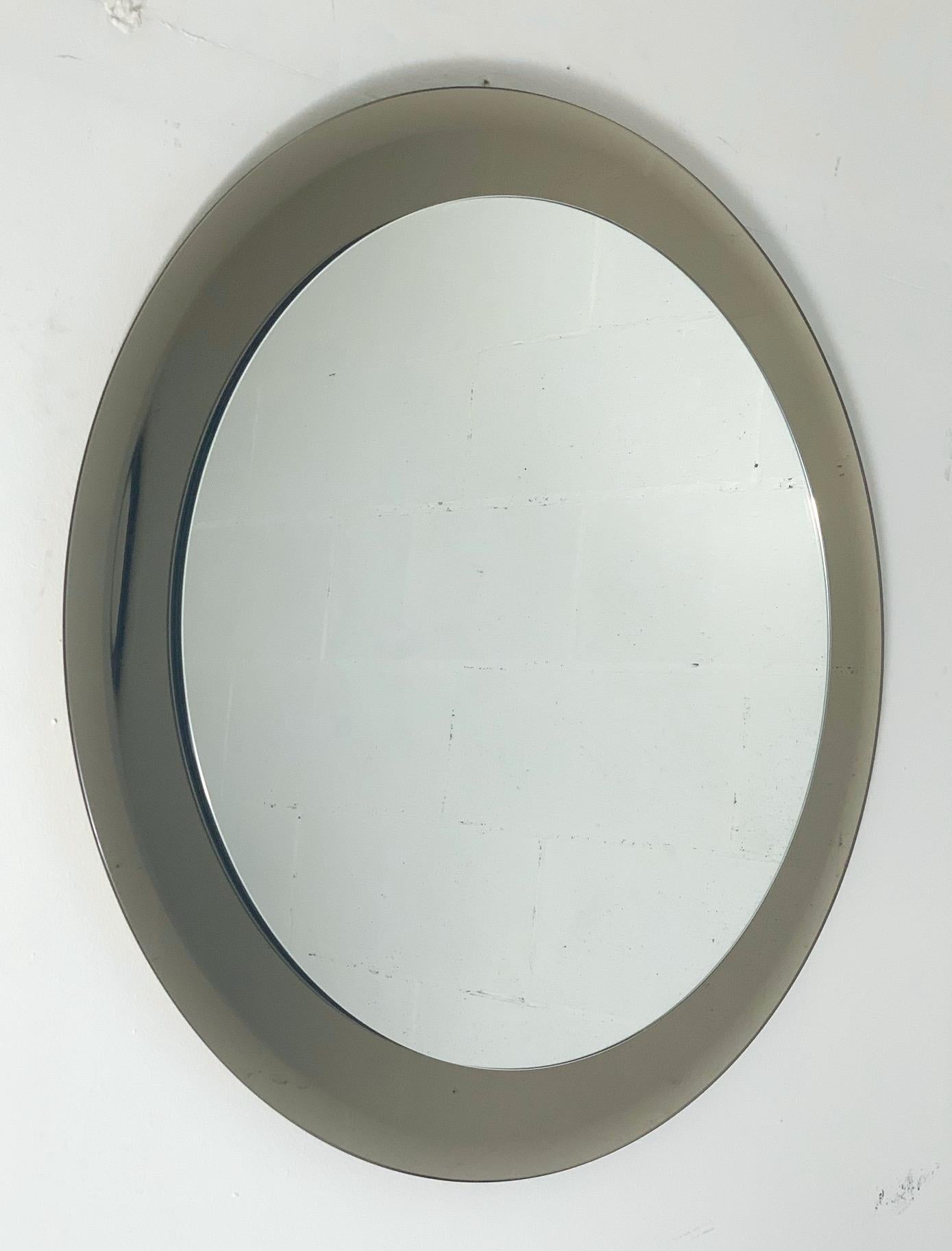 Vintage Italian round mirror with beveled glass in smoky bronze color / made in Italy by Lupi, circa 1960s
Original 