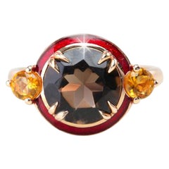 Bague design Art déco haute couture en topaze fumée et citrine rouge émaillée