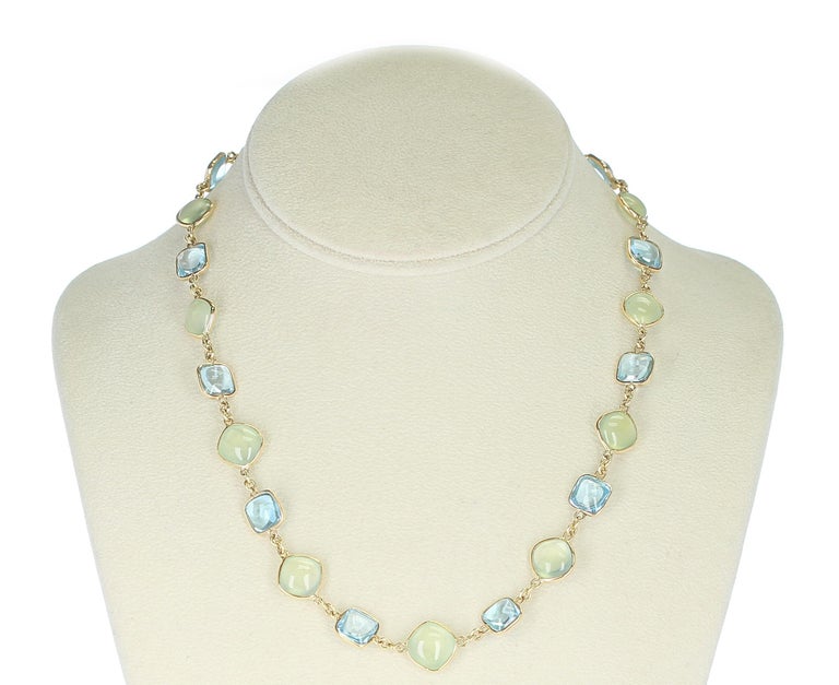 A fine 18K Yellow Gold Necklace with smooth Double Cabochon Blue Topaz and Green Prehnite. Length: 18 Inches, Weight: 170 carats, 750 Stamped. 