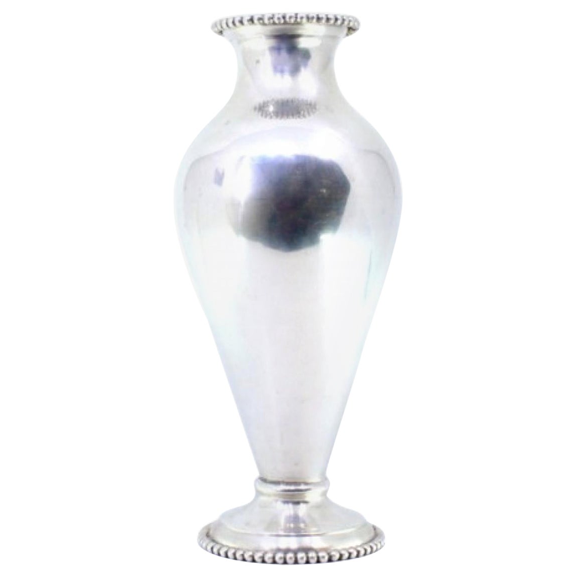 Smooth, rounded silver jug, with pearls on the rim and circular base For Sale