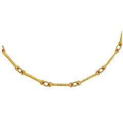Collana a segmenti lisci in oro 18 K.