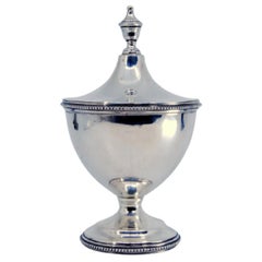 Smooth silver bonbon jar w/ pearls on the rim 
base, w/ application on the lid