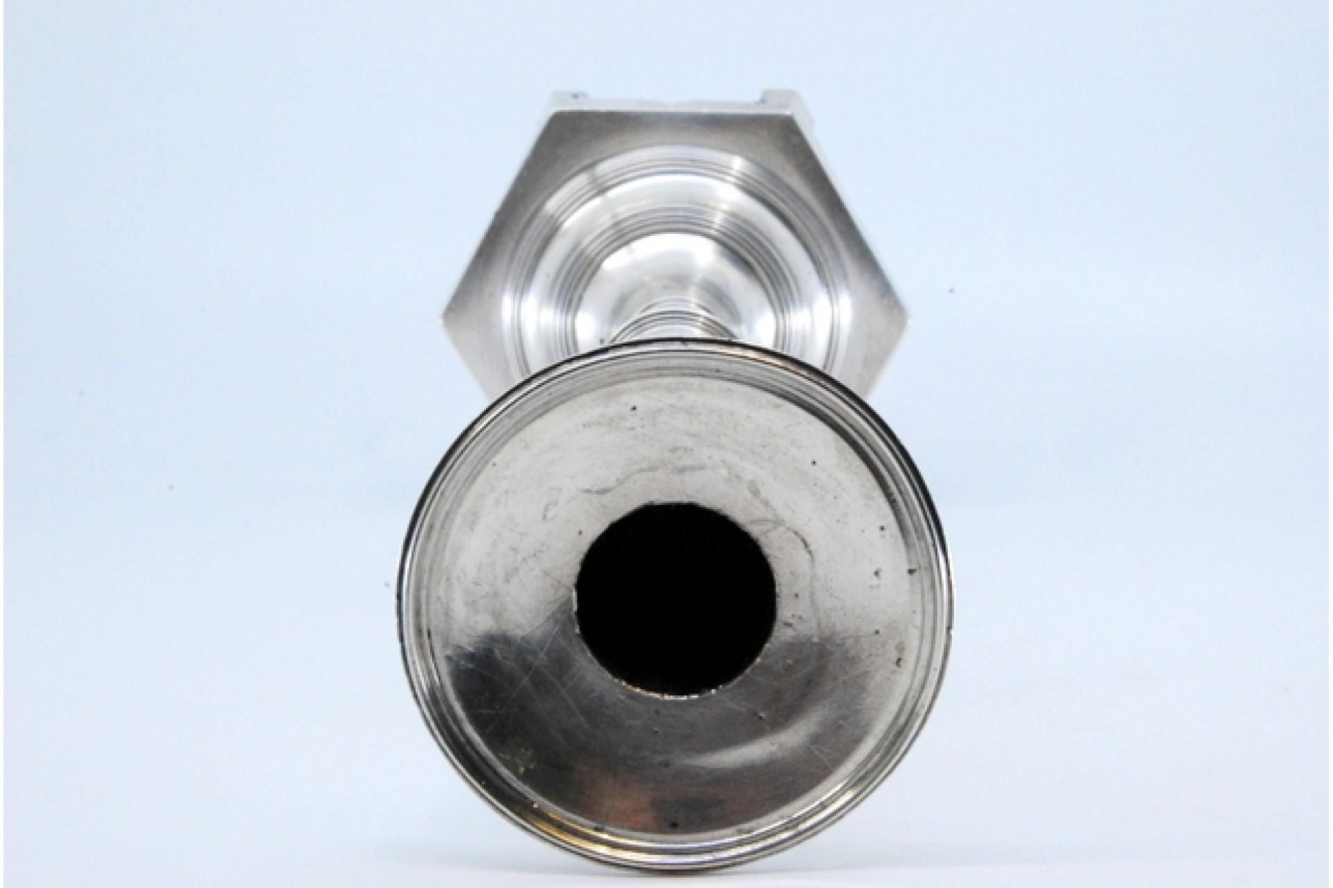 European Smooth silver candlestick with turned shaft on hexagonal base For Sale