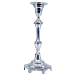 Smooth silver candlestick with turned shaft on hexagonal base