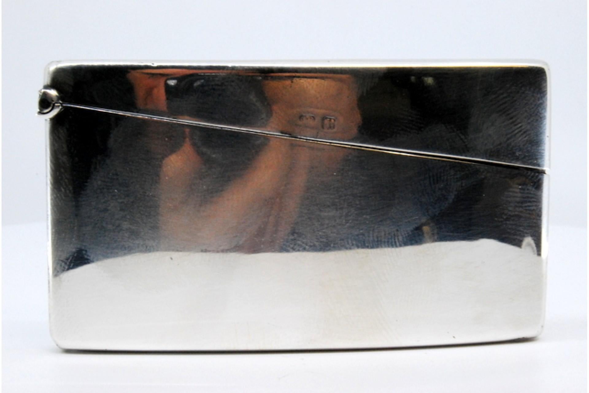 Description: Smooth silver card case with a curved shape. Metal: Silver. Origin: English. Brand: Birmingham. Weight: 72.61 grams. Dimensions: 8x0.6cm. Content: 925/1000. Assay Mark: Yes, 1910 by George Unite. Additional information: Good condition.