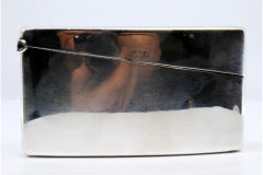 Smooth silver cardboard box with a curved shape