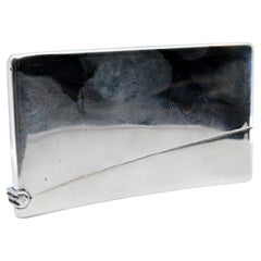 Smooth silver cardboard box with a curved shape