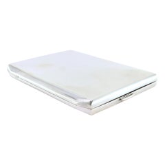Smooth silver case with beveled corners, interior ribbons, hinged lid