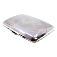 Smooth silver case with curved shape, pull tab, and two interior straps