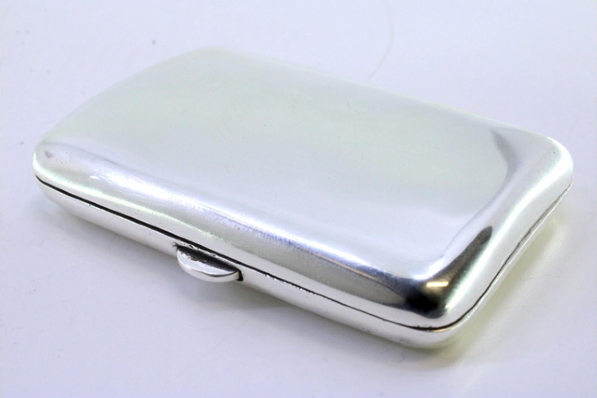 20th Century Smooth silver cigarette case with a curved shape and a spring-loaded hinged lid For Sale