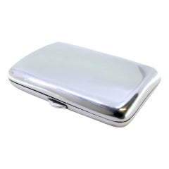 Smooth silver cigarette case with a curved shape and a spring-loaded hinged lid Smooth silver cigarette case with a curved shape and a spring-loaded hinged lid