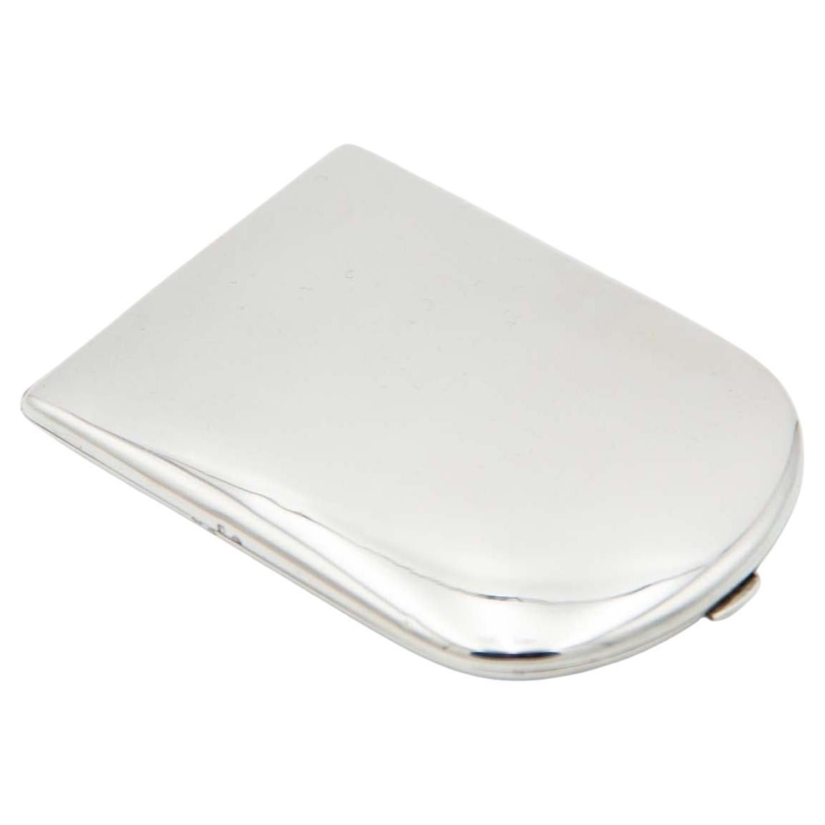 Smooth silver cigarette case with a semi-oval shape