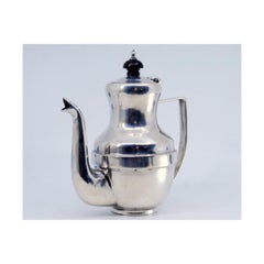 Smooth silver coffee pot with chestnut wood application on the lid
