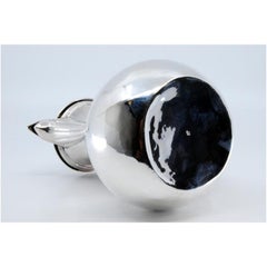 Smooth silver coffee pot with chestnut wood handle and knob on the lid