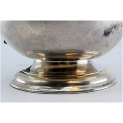 Smooth silver coffee pot with chestnut wood handle and knob on the lid