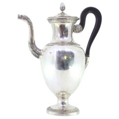 Smooth silver coffee pot with friezes, chestnut handle and acorn knob