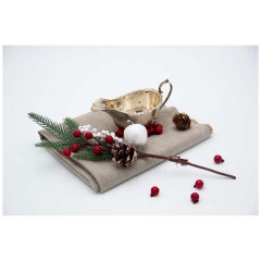 Antique Smooth silver creamer with scalloped rim, appliqué handle and set on four feet