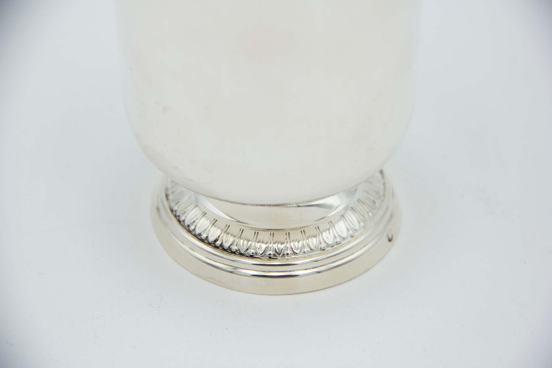 Description: Smooth silver cup with a circular base in relief with a frieze. Metal: Silver. Origin: Portuguese. Brand: Tête Minerve. Weight: 109.15 grams. Dimensions: 9cmx11.5cm. Content: 950/1000. Assay Mark: Yes, since 1838. Additional