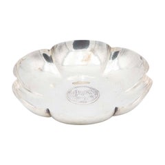 Smooth silver flower-shaped fruit bowl with Swiss coin