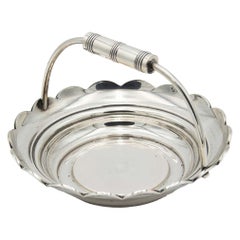 Smooth silver fruit bowl with fixed beaded handle