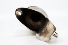 Smooth silver milk jug with strips on the base and knob on the hinged lid