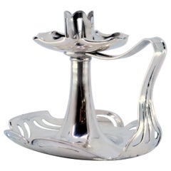 Smooth silver paddle cut in the Art Nouveau style