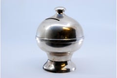 Smooth silver piggy bank with filled bottom and knob on top