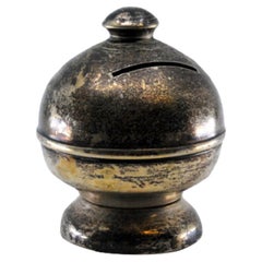 Smooth silver piggy bank with filled bottom and knob on top