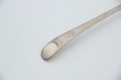 Smooth silver shell with friezes