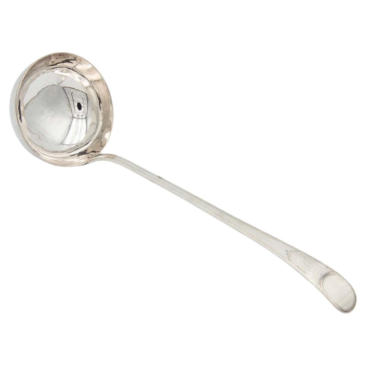 Smooth silver shell with friezes