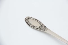 Smooth silver shell with reliefs