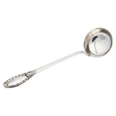 Smooth silver shell with reliefs