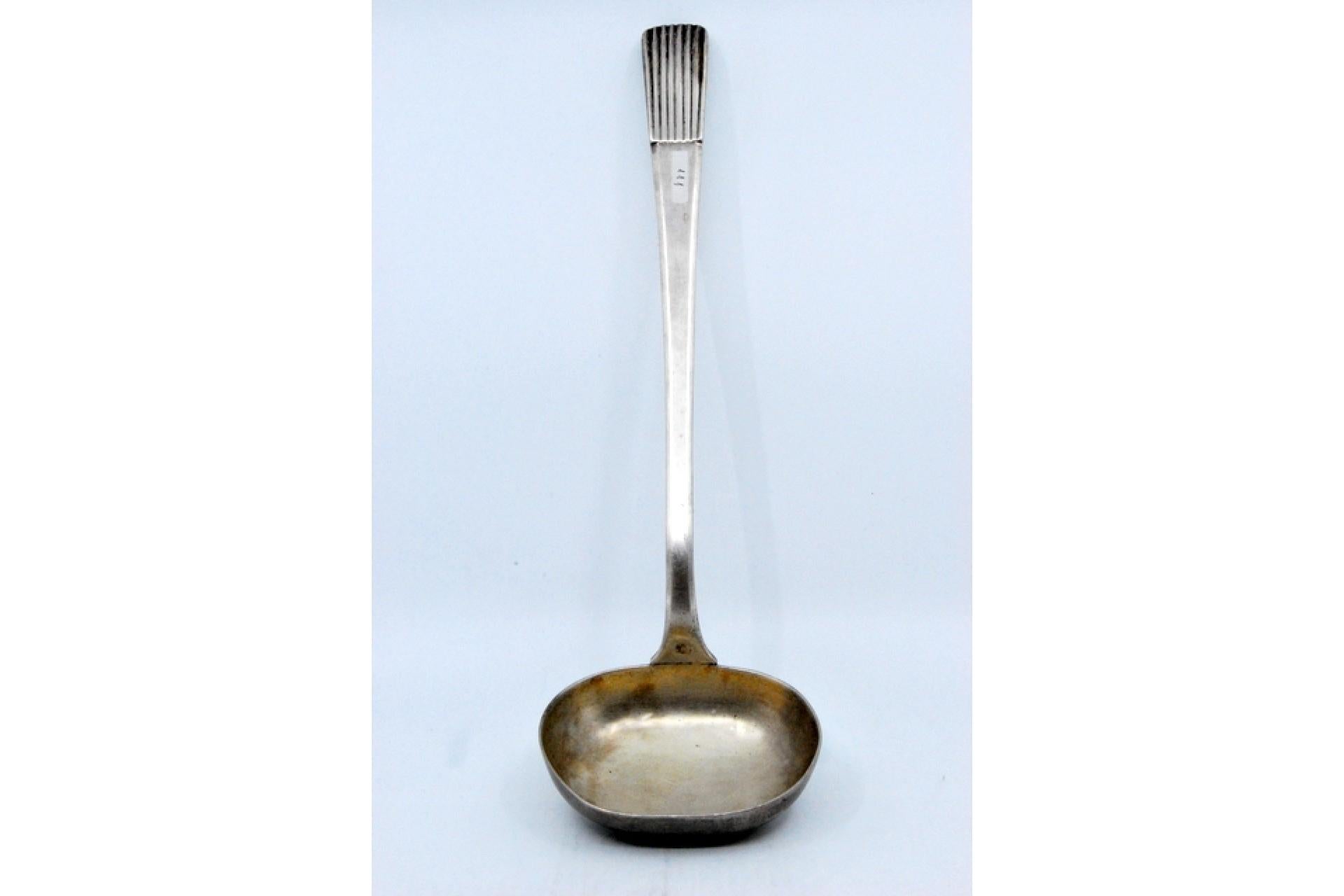 European Smooth silver soup ladle with a raised handle in the reed style For Sale