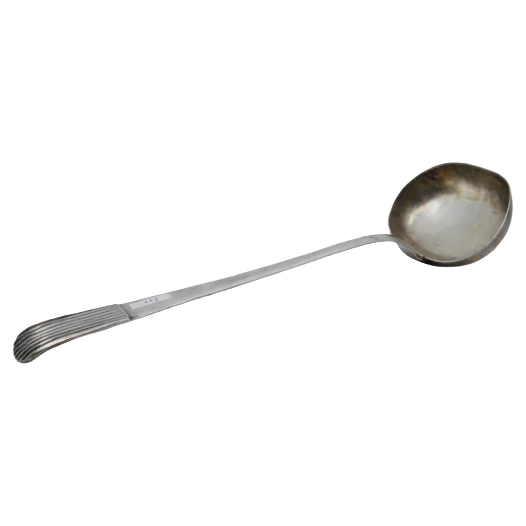 Smooth silver soup ladle with a raised handle in the reed style