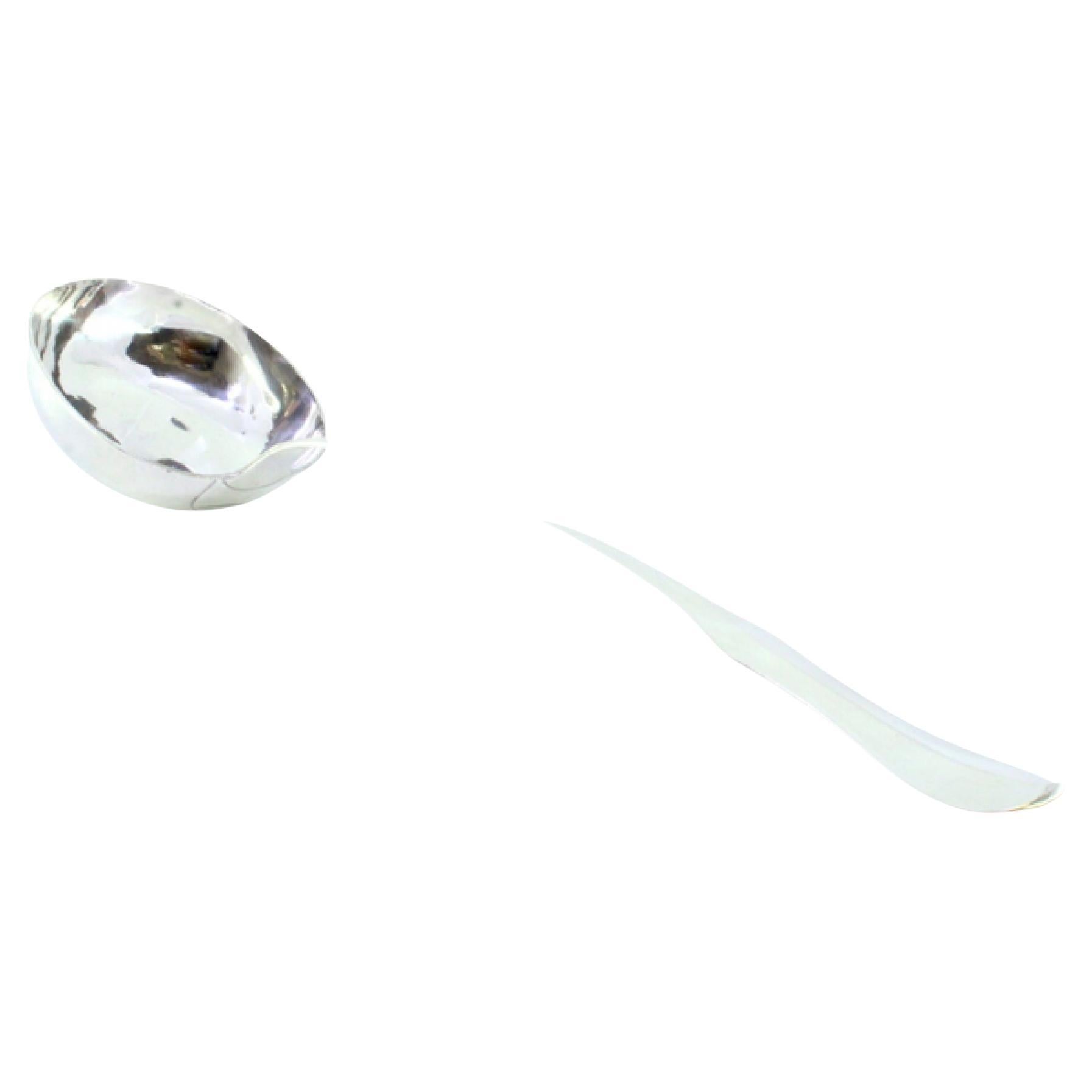 Smooth silver soup ladle with a scalloped handle