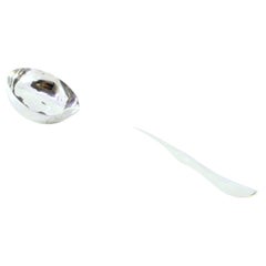 Smooth silver soup ladle with a scalloped handle
