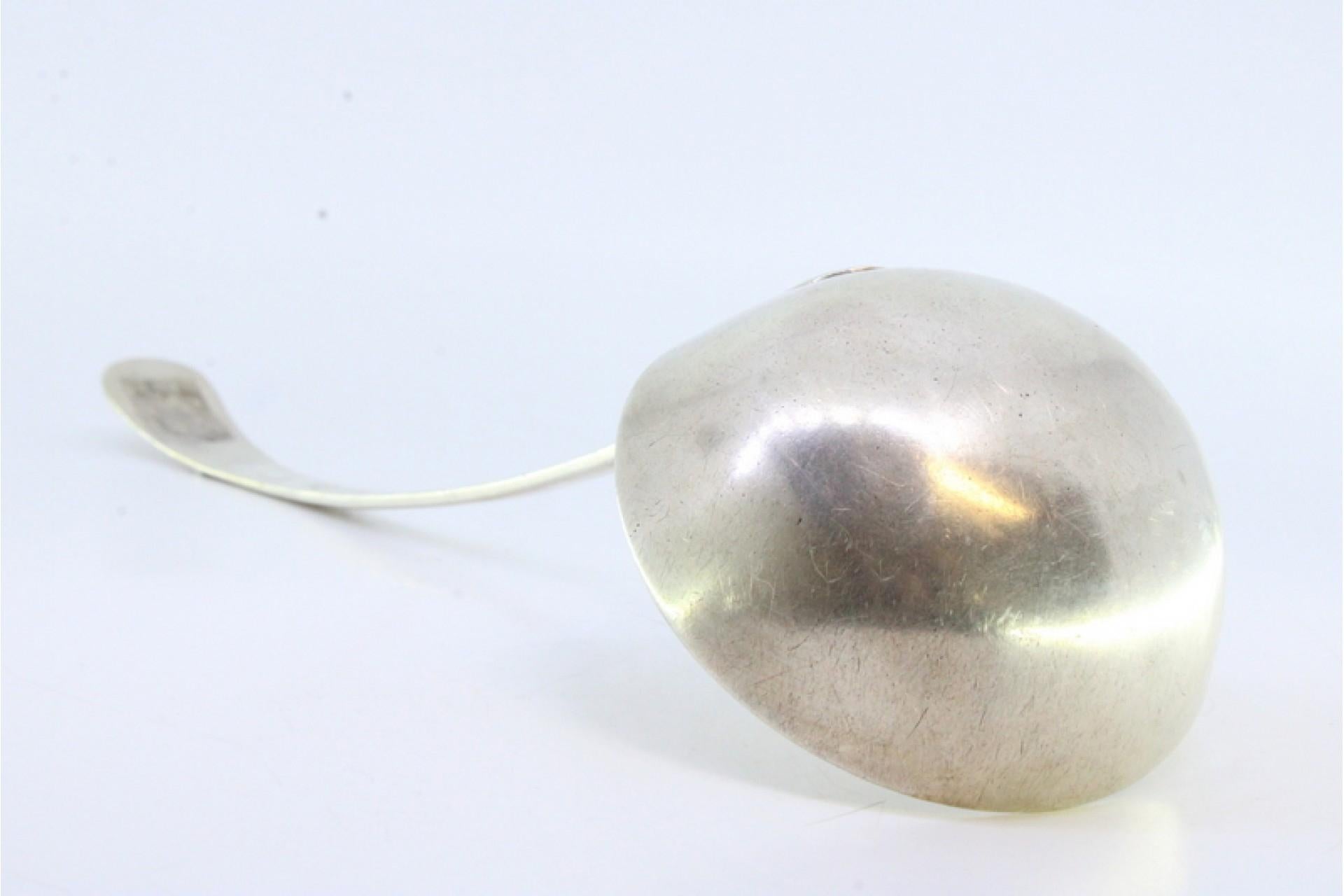 18th Century Smooth silver soup ladle with embossed handle For Sale