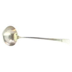 Smooth silver soup ladle with embossed handle Smooth silver soup ladle with embossed handle
