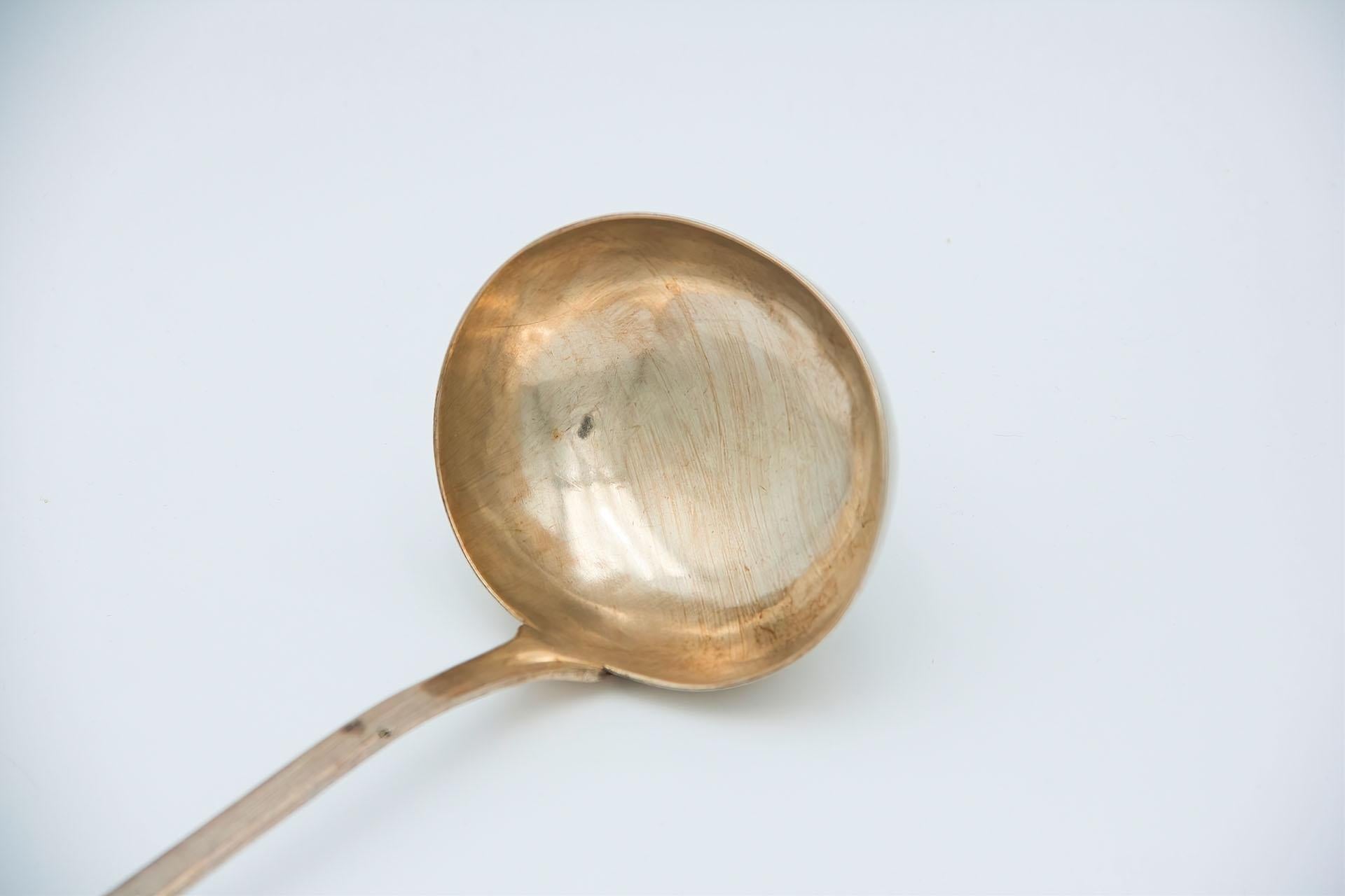 Description: Plain silver soup ladle with embossed caninha-style handle. Metal: Silver. Origin: Portuguese. Brand: Porto Coroa. Weight: 170.31 grams. Dimensions: 31.6cmx7cm. Content: 833/1000. Assay Mark: Yes, from the 15th century to 1885.