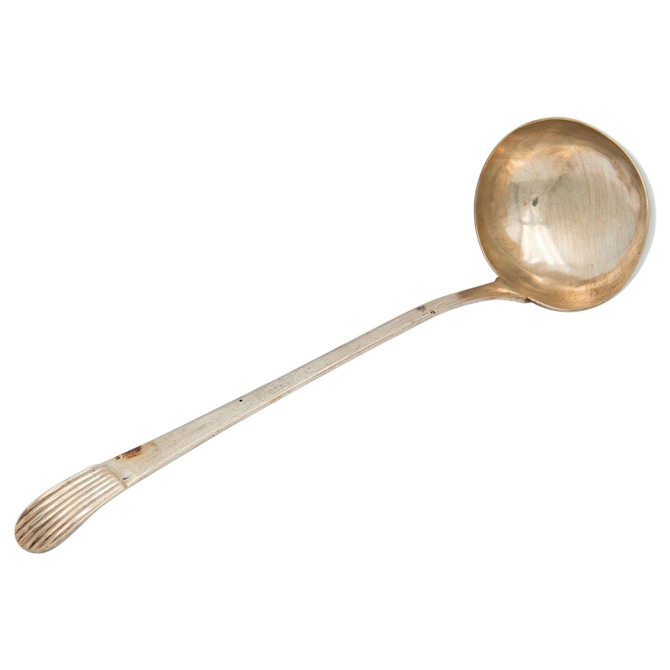 Smooth silver soup ladle with embossed handle in the reed style