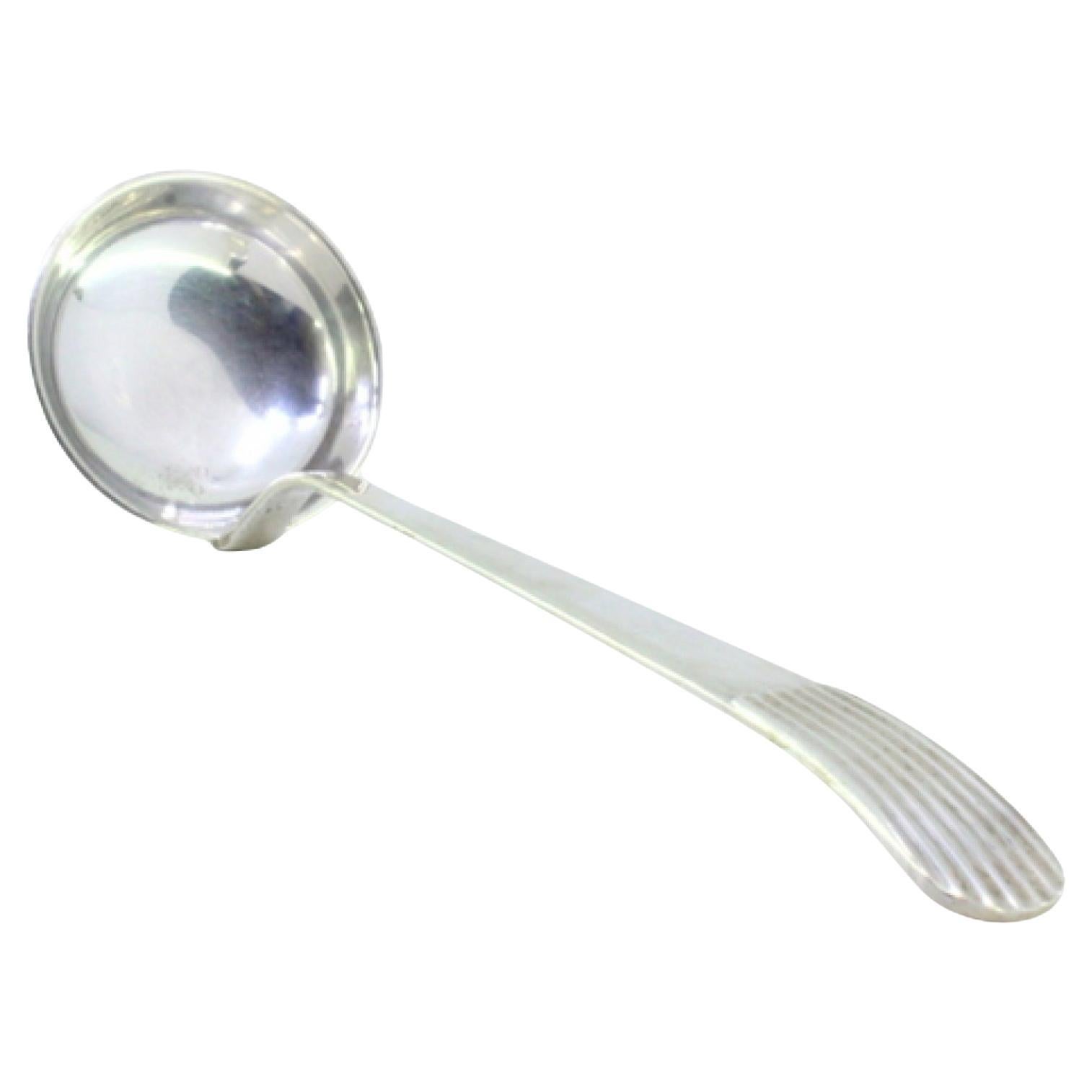 Smooth silver soup ladle with embossed reed-style handle