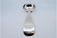 Smooth silver soup ladle with expedited handle