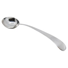 Smooth silver soup ladle with expedited handle