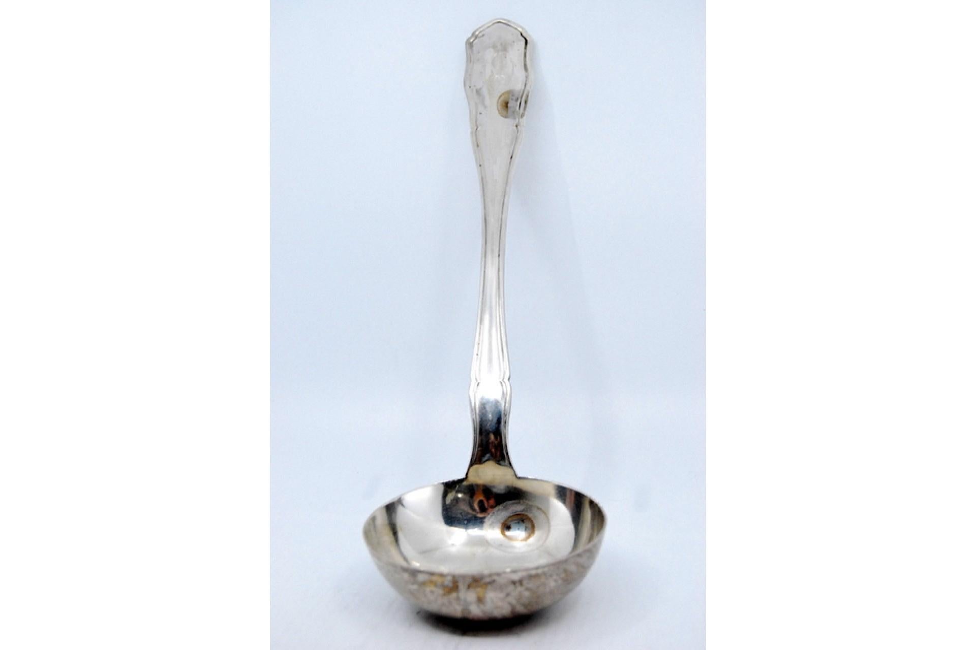 Description: Smooth silver soup ladle with grooves along the handle. Metal: Silver. Origin: Spanish. Brand: Astrain. Weight: 275.57 grams. Dimensions: 31.5x9cm. Content: 925/1000. Assay Mark: Yes. Additional information: Good condition.
