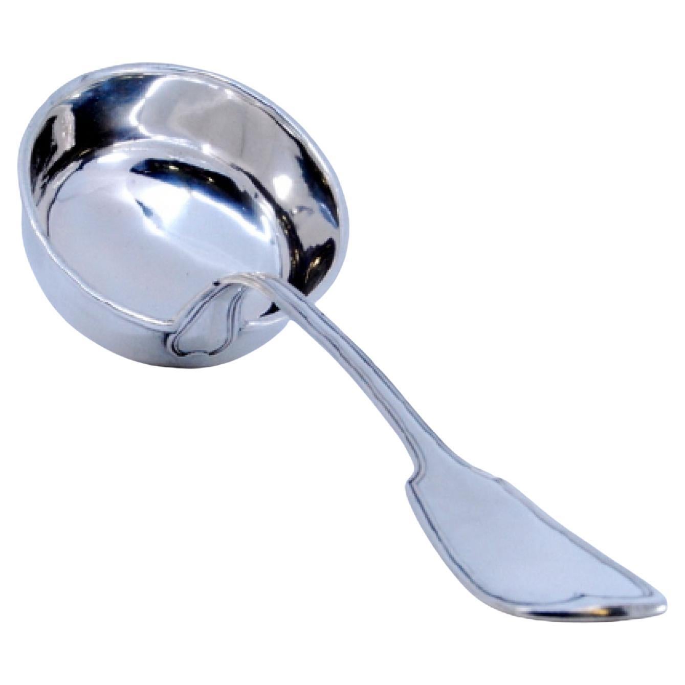 Smooth silver soup ladle with grooves along the handle