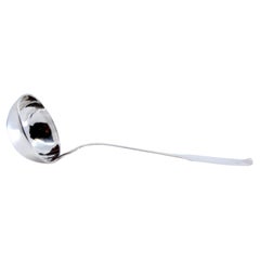 Smooth silver soup ladle with relief on the handle