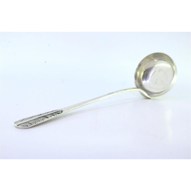 Smooth silver soup ladle with reliefs on the handle (Silber) im Angebot