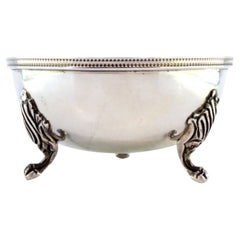 Smooth silver washbasin with rim reliefs on three claw feet