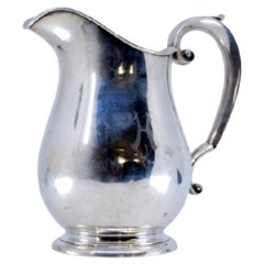 Smooth silver water jug