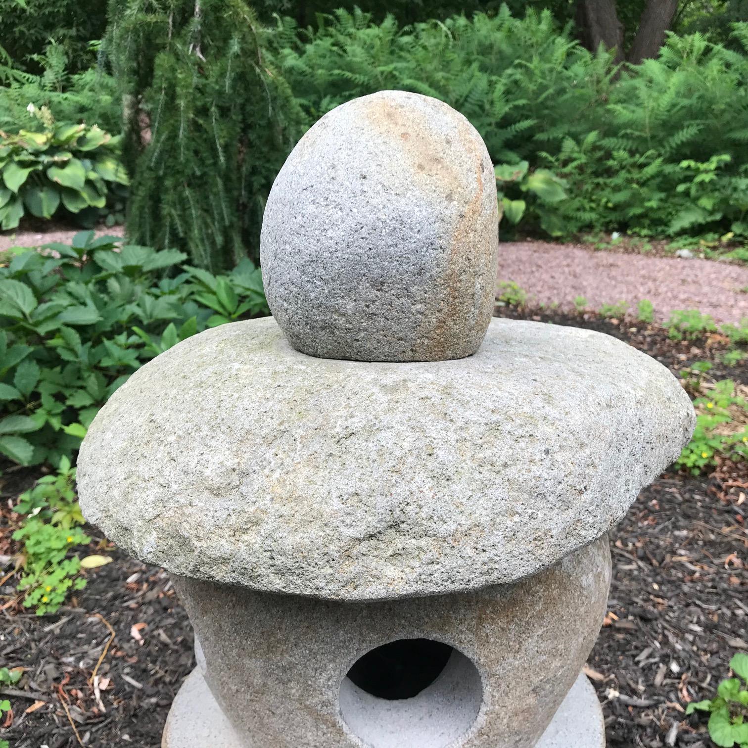 Here's a very nice sized stone -Spirit- lantern carved from natural boulders and ideally suited for a small to medium garden out of doors or inside in your favourite sun space. 

The striking and well proportioned stone lantern is fashioned in